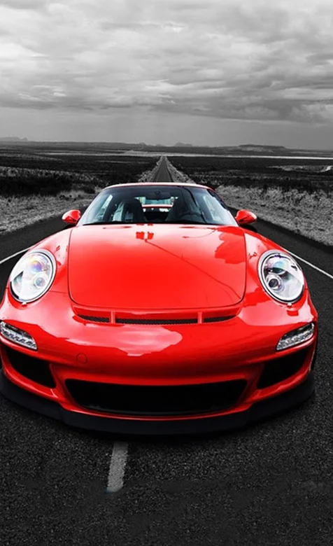 高速公路上的红色跑车车头特写手机壁纸下载