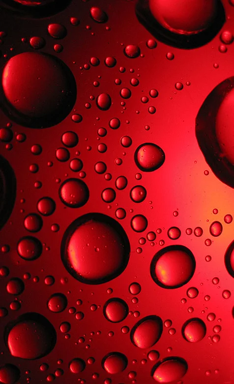 红色玻璃上的水滴高清手机桌面图片