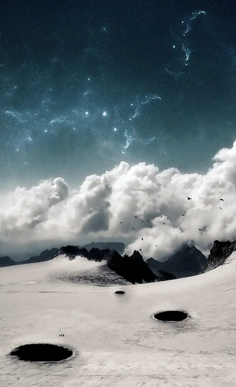 白云覆盖的雪山手机桌面壁纸