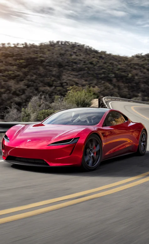 红色特斯拉电动跑车山路驰骋的手机壁纸