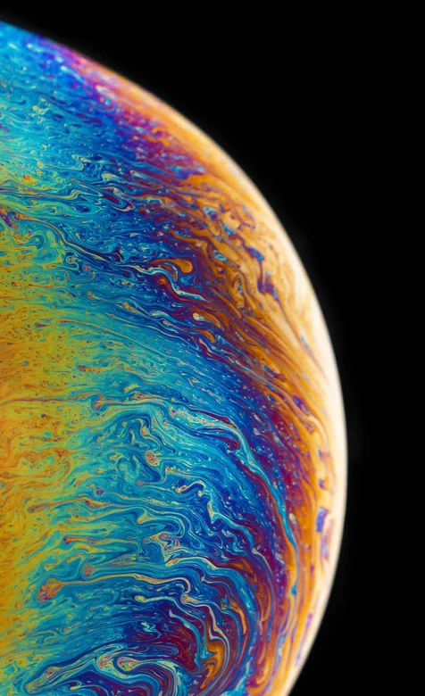 苹果X系列手机系统自动七彩星球的手机壁纸