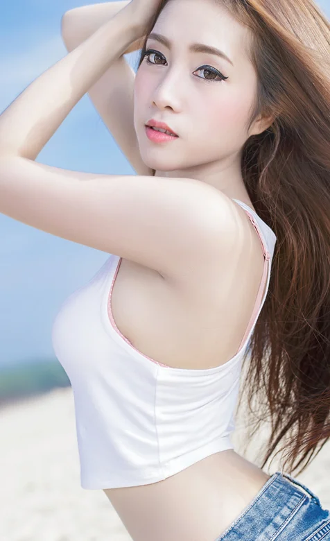 沙滩摄影穿牛仔裤的长发美女